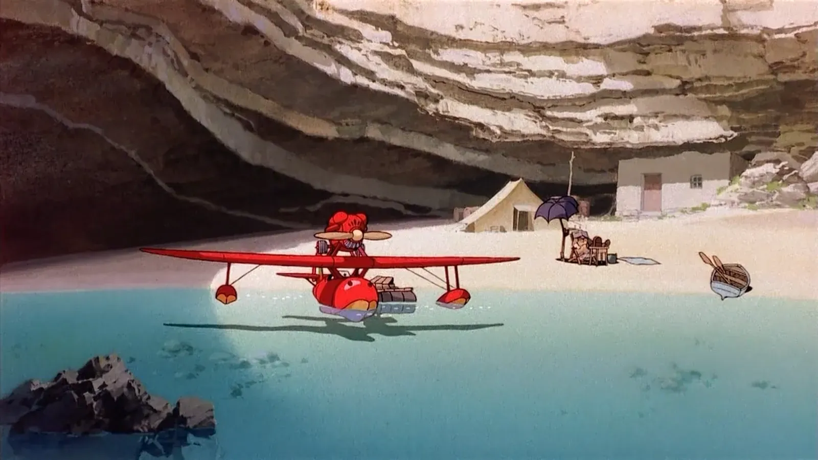Still from Porco Rosso showing plane in beach cove