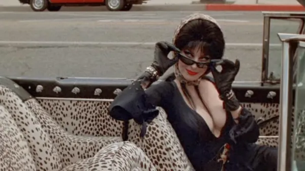 Still from Elvira Mistress of the Dark, showing Elvira in her car