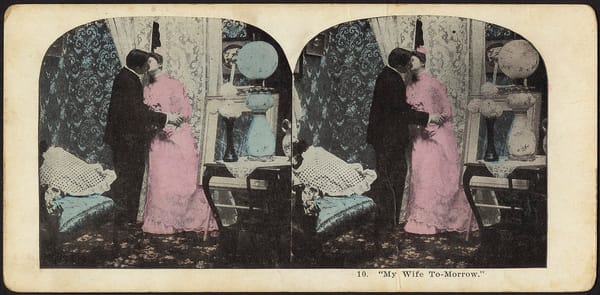 stereograph showing a man and women kissing in victorian dress
