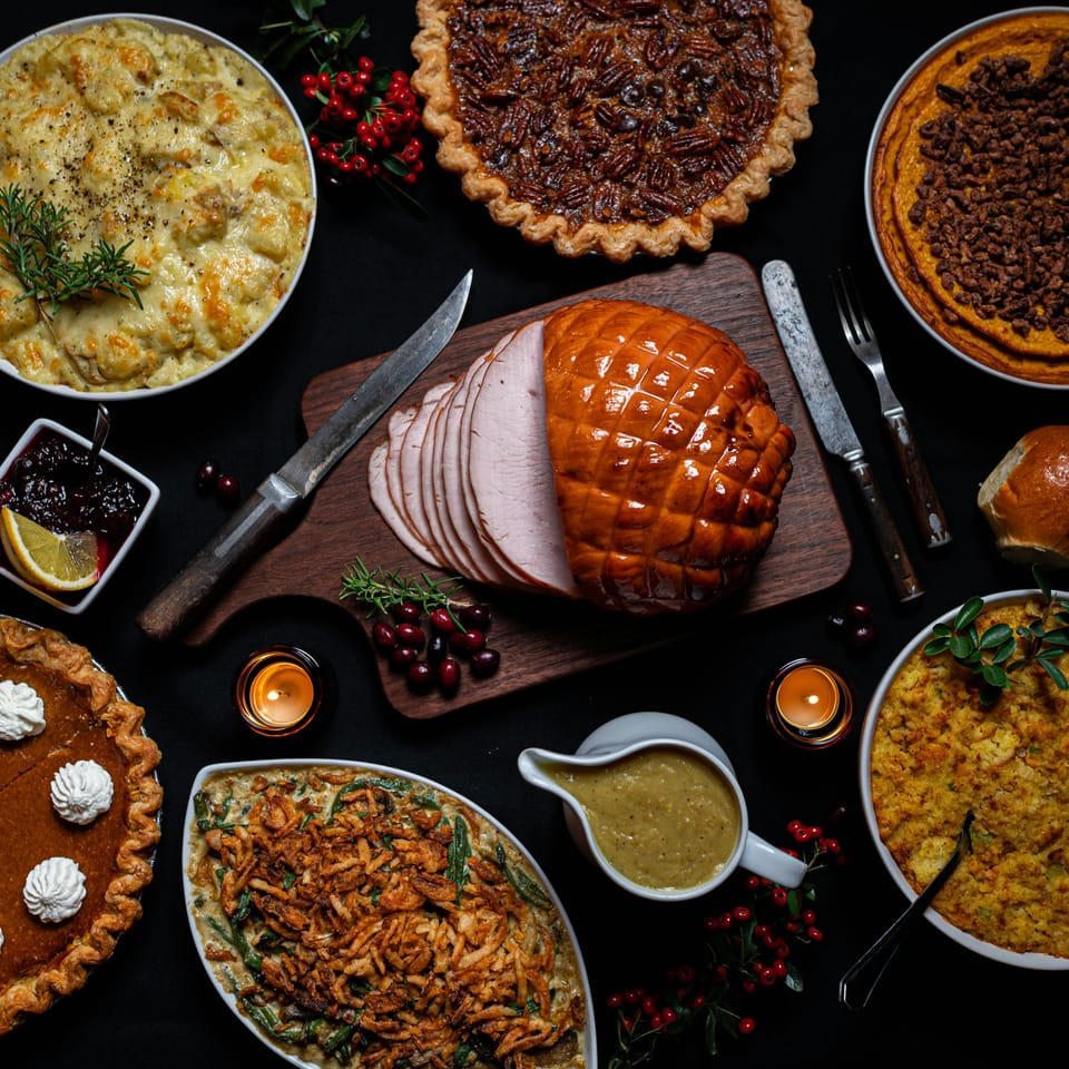 Carved meat surrounded by pies